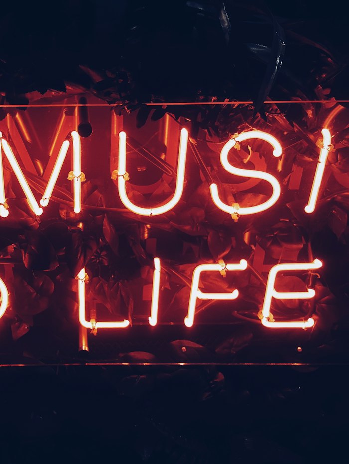 A neon sign in the loft window