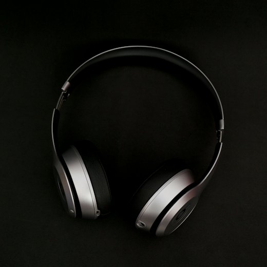 Studio headphones on a dark surface
